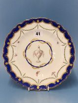 A Chelsea Derby plate painted with swags of laurel below the Smiths blue wavy rim, the central urn