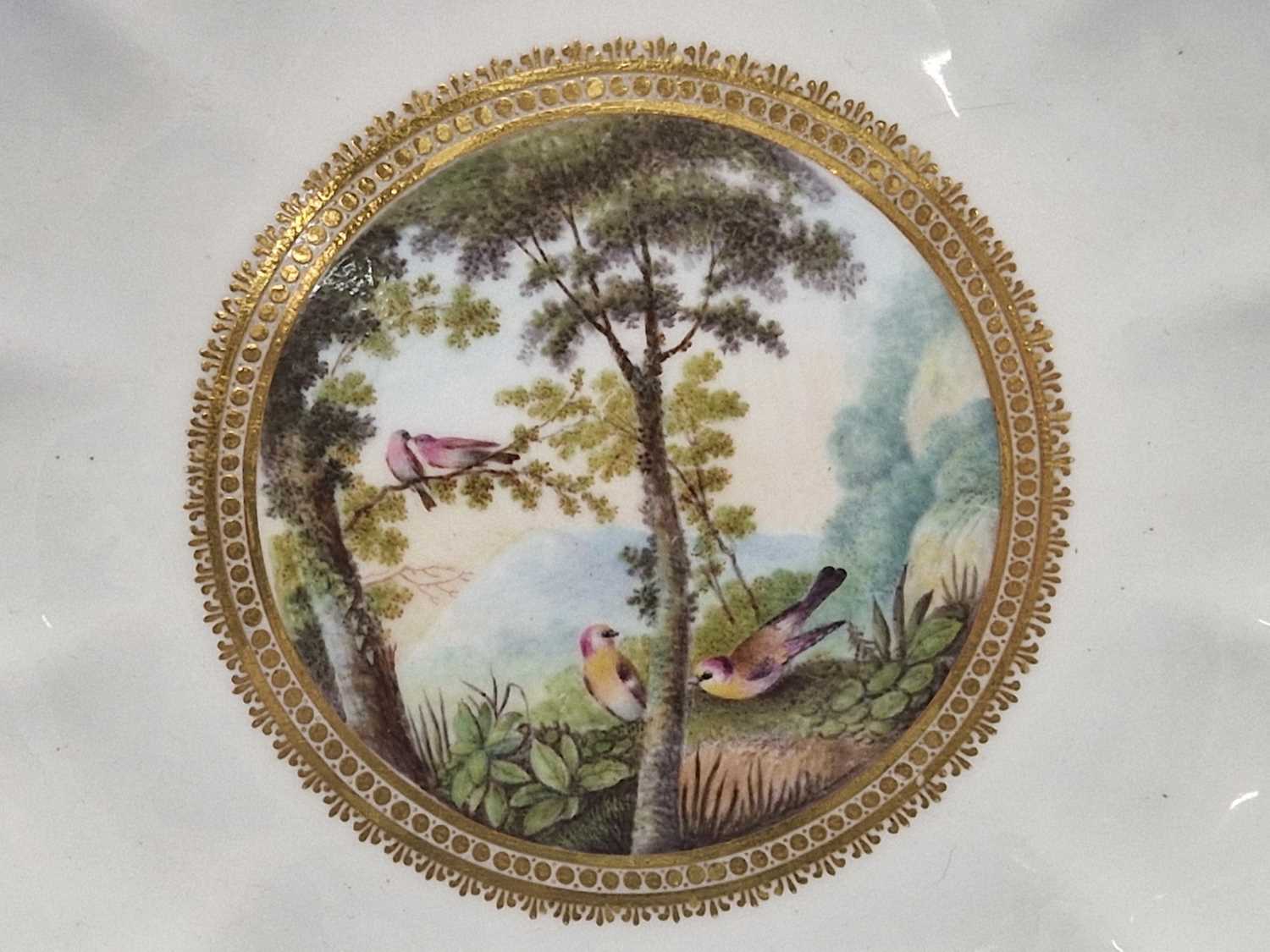 A Derby plate painted by George Robertson with birds in a landscape within a gilt wavy edged rim, - Image 3 of 12