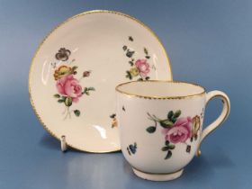 A Chelsea Derby coffee cup and saucer, each painted with three sprigs of flowers within gilt
