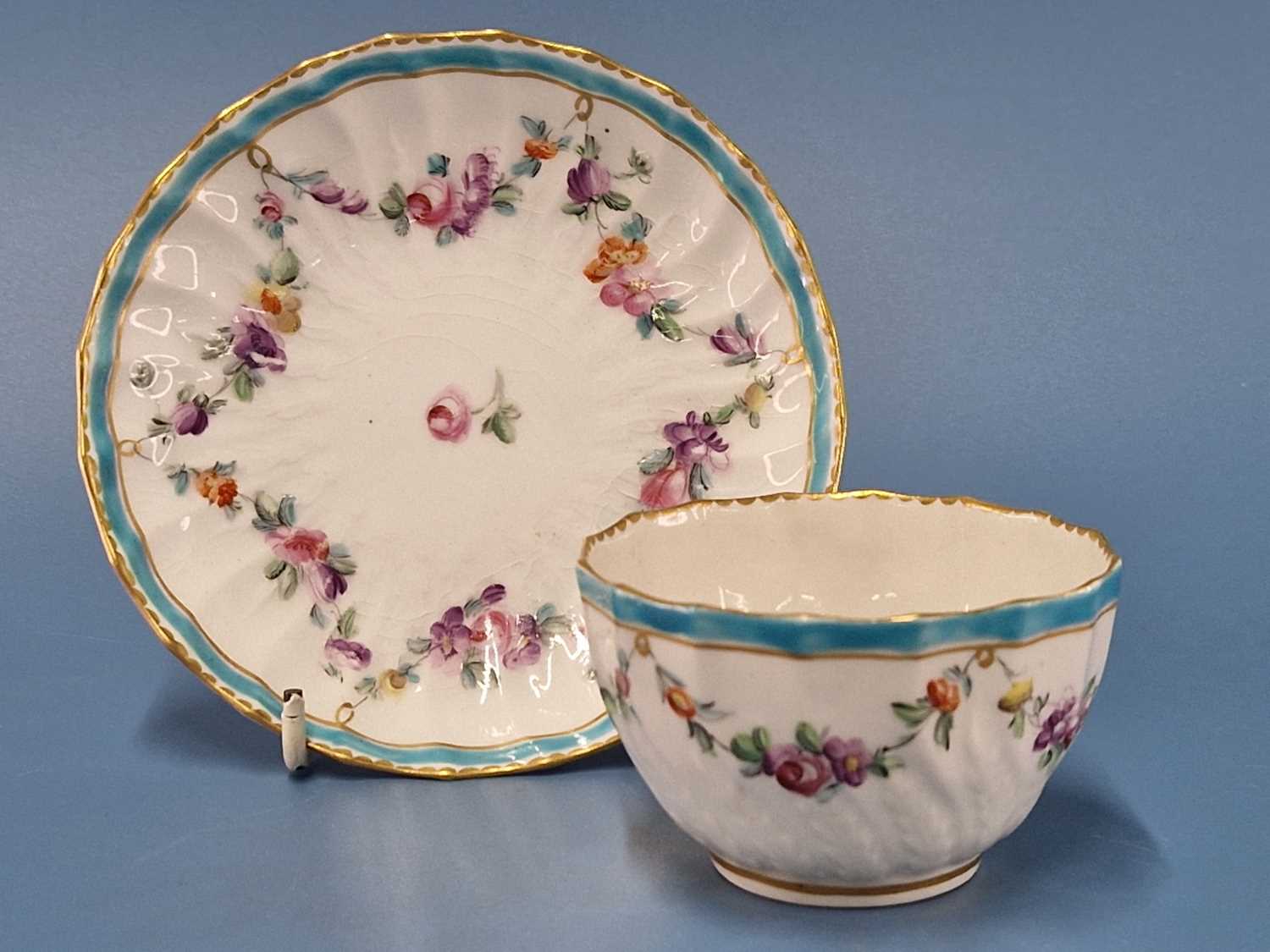 A Derby wrythen tea bowl and saucer painted with a turquoise blue band and floral swags, blue marks, - Image 2 of 2