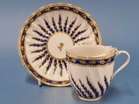 A Derby coffee cup and saucer moulded and painted in Smiths blue with gold edged serrated leaves,