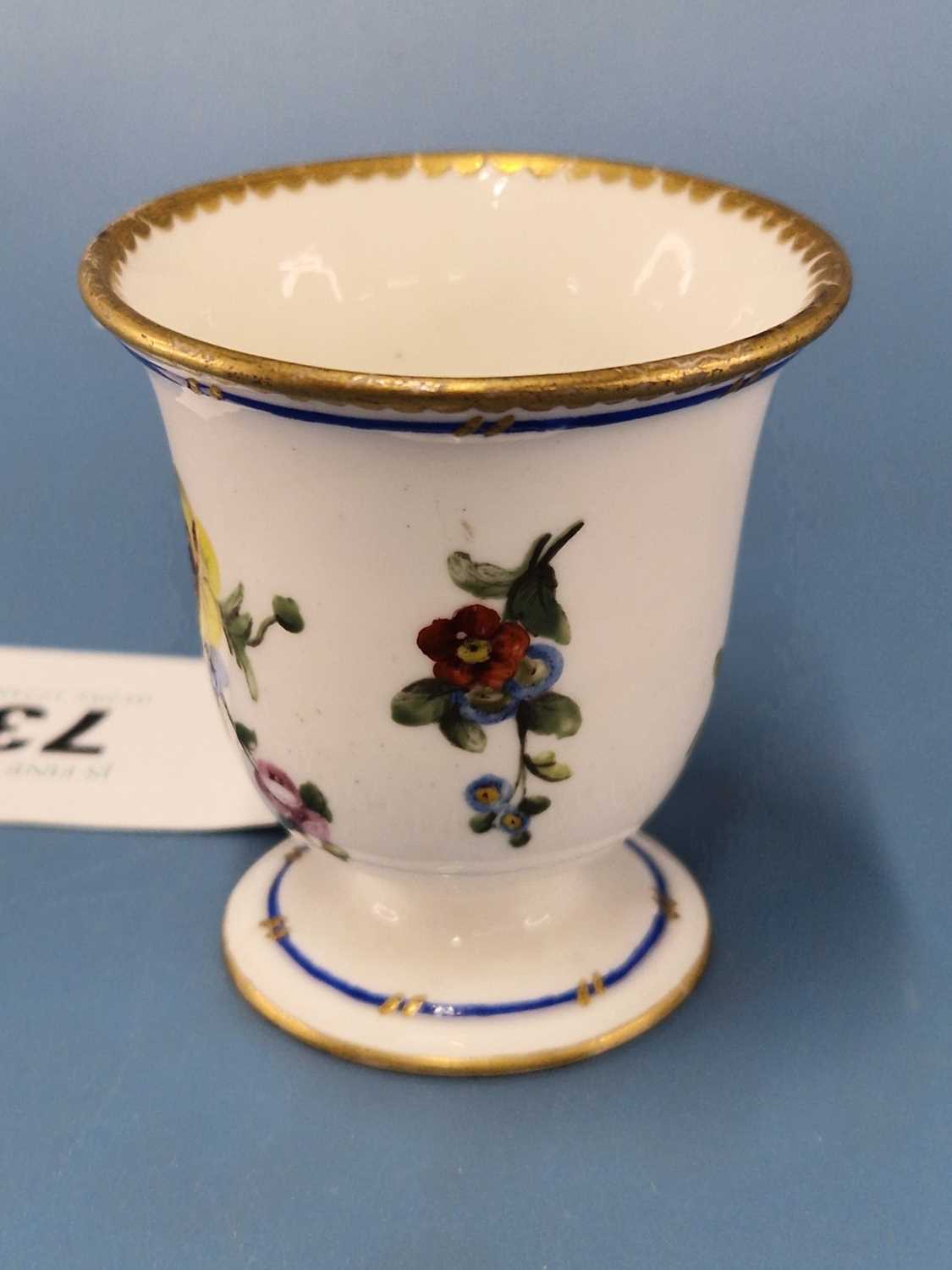 A Sevres ice cup painted with a blue line and flower sprays below a gilt dentil rim line The - Image 3 of 6
