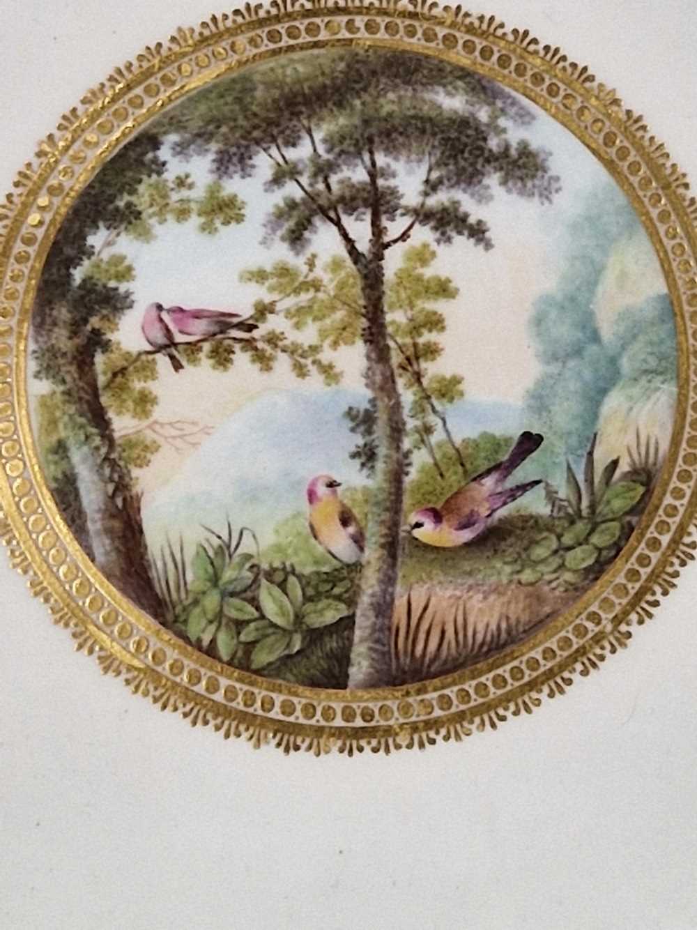 A Derby plate painted by George Robertson with birds in a landscape within a gilt wavy edged rim, - Image 9 of 12