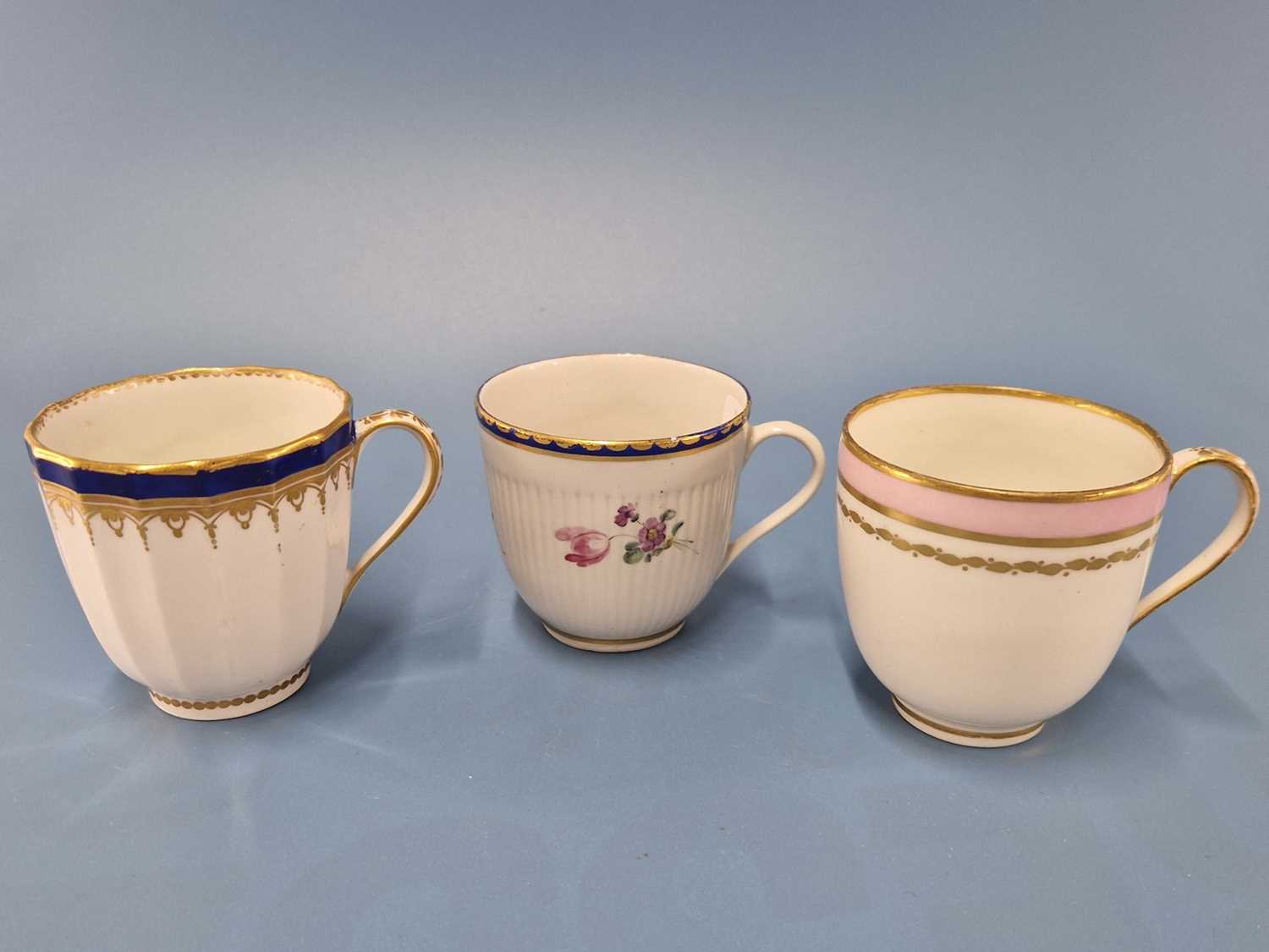 A Derby ribbed coffee cup painted with sprays of flowers below the gilt dentil rim, blue mark, - Image 2 of 3