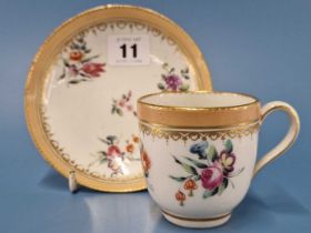 A Chelsea Derby coffee cup and saucer with salmon bands enclosing three sprays of flowers,