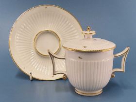 A Chelsea Derby two handled trembleuse cup, cover and saucer, the ribbed bodies gilt with sprigs,