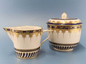 A Chelsea Derby milk jug and a covered sugar painted in Smiths blue and gilt with spikey pendants,