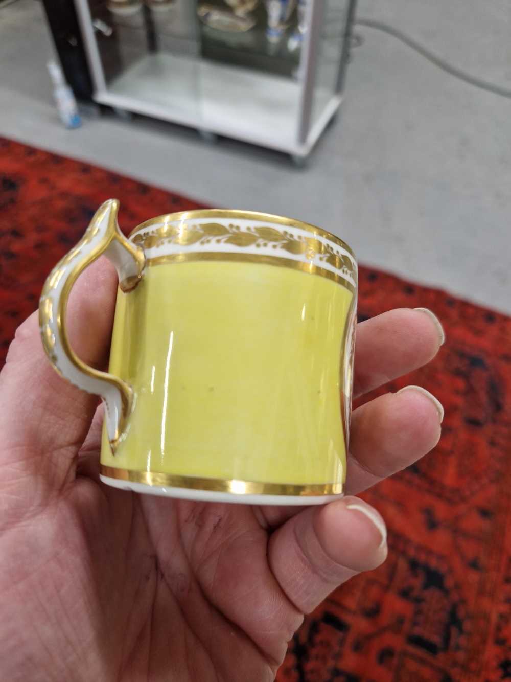 A Derby yellow ground coffee can and saucer, the former painted with a roundel of flowers, puce - Image 11 of 13