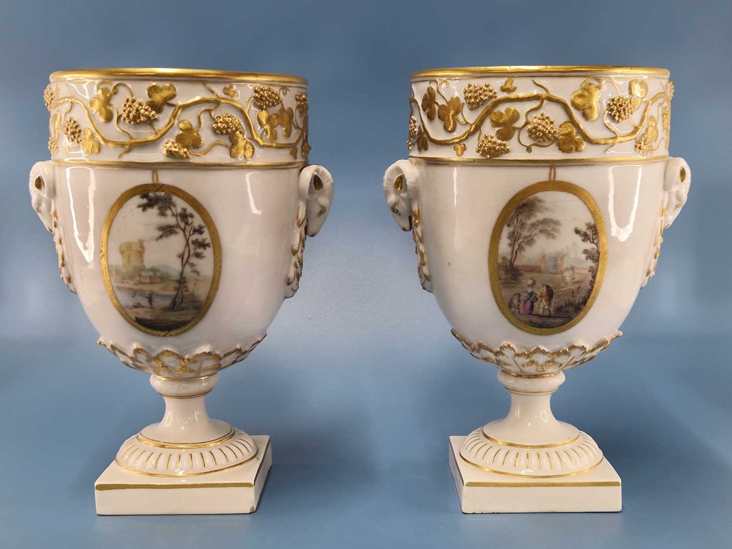 A pair of Derby ram handled vases supported on square feet painted with landscapes by Askew or - Image 2 of 17