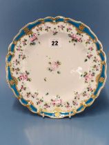 A Chelsea Derby plate, the wavy rim painted in turquoise enclosing pink rose swags, gilt mark, RF