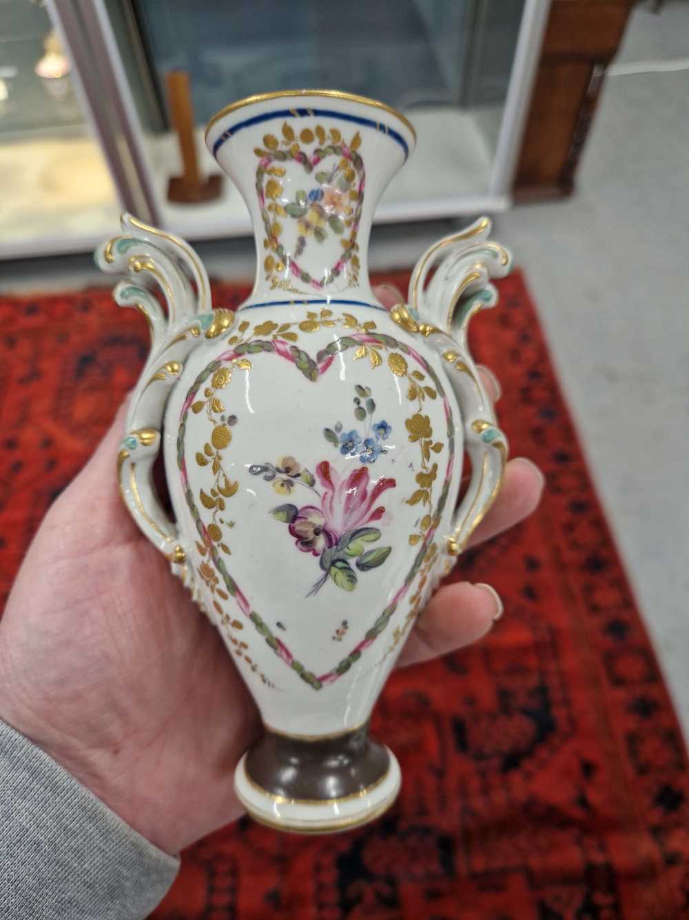 A Derby two handled vase painted with heart-shaped reserves of flowers, the foot with a brown - Image 3 of 13