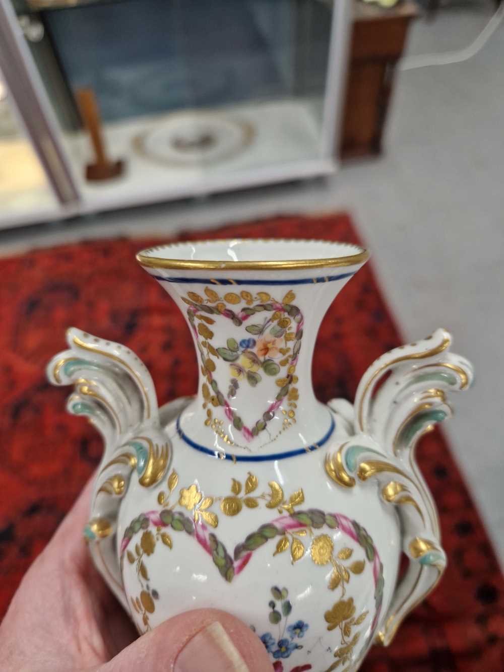 A Derby two handled vase painted with heart-shaped reserves of flowers, the foot with a brown - Image 7 of 13