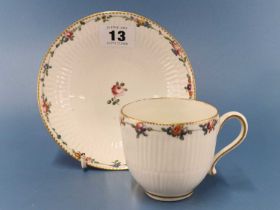 A Chelsea Derby coffee cup and saucer, the bodies moulded with two bands of ribbing and painted with