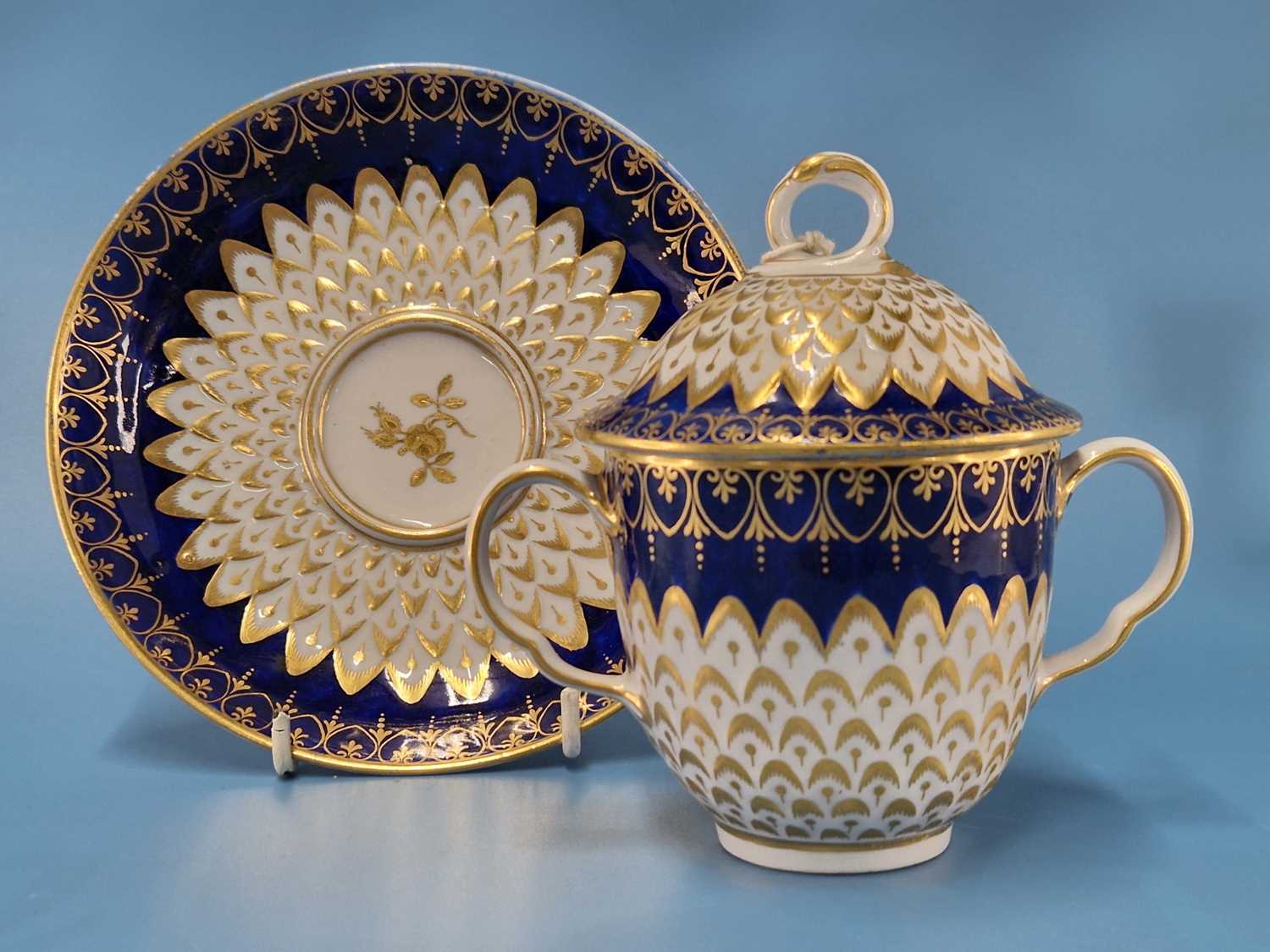 A Derby two handled cup, cover and saucer with royal blue rims enclosing gilt and moulded - Image 2 of 8