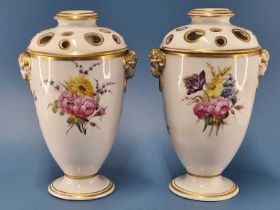 A pair of Derby ram handled pot pourri vases and pierced covers, the painting of flowers
