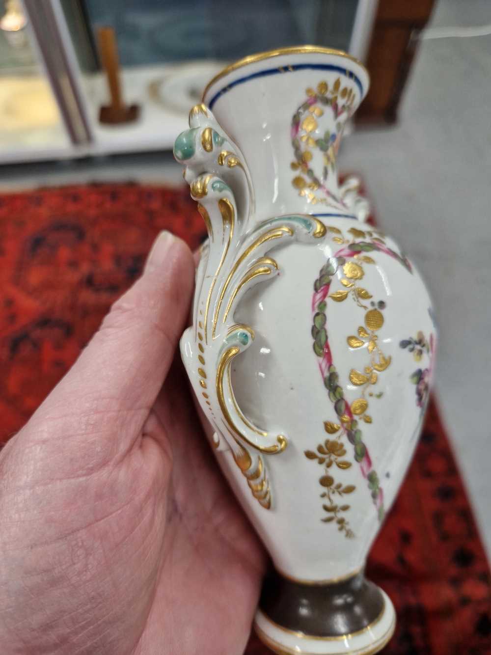 A Derby two handled vase painted with heart-shaped reserves of flowers, the foot with a brown - Image 5 of 13