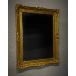 GILT SWEPT FRAME MIRROR. 740 x 590 mm