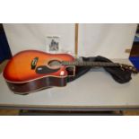 An Encore model No 165EAR guitar and carrying case