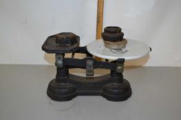 A further weighing scale with porcelain plate and number of weights