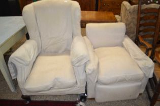 Two armchairs with fabric coverings
