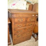 An oak chest of drawers