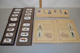 Small collection of cigarette cards in original booklets including military uniforms, cricketers