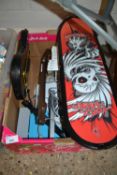 Box containing a skateboard and other items