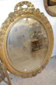 Large oval mirror in gilt wooden frame