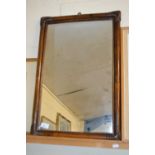 A mirror in rectangular bamboo type frame