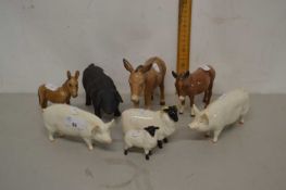 Group of Beswick animal figures including pigs, donkeys and sheep (8)
