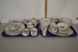 A quantity of Denby dinner and tea wares decorated with a green floral design including four large
