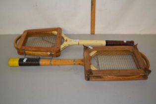 Two vintage tennis rackets and holders by Slazenger and Dunlop