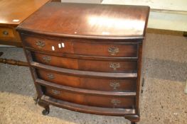 A bow fronted five drawer cabinet