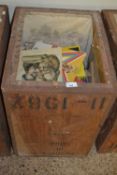 A tea chest with a further quantity of books