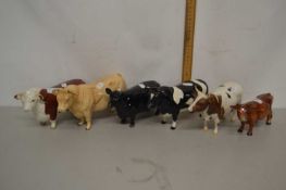 A group of animal figures mainly cows and bulls including a champion Whitehill Mandate, champion
