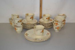 An English porcelain part tea set, decorated with a floral design