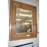 A framed rectangular mirror