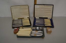 Three boxes of plated cutlery and two small printing blocks