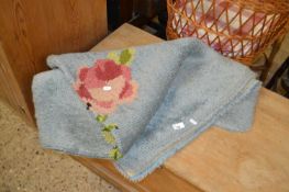 Blue woollen rug with floral design