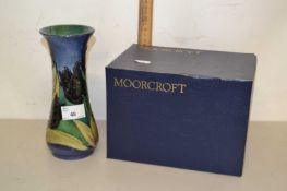 Modern Moorcroft vase in baluster form with two blind floral design, 20cm high