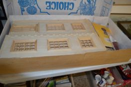 A boxed, unbuilt wooden Georgian-style dolls' house, with original retail catalogue. Height