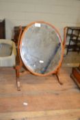Small oval mirror in wooden frame
