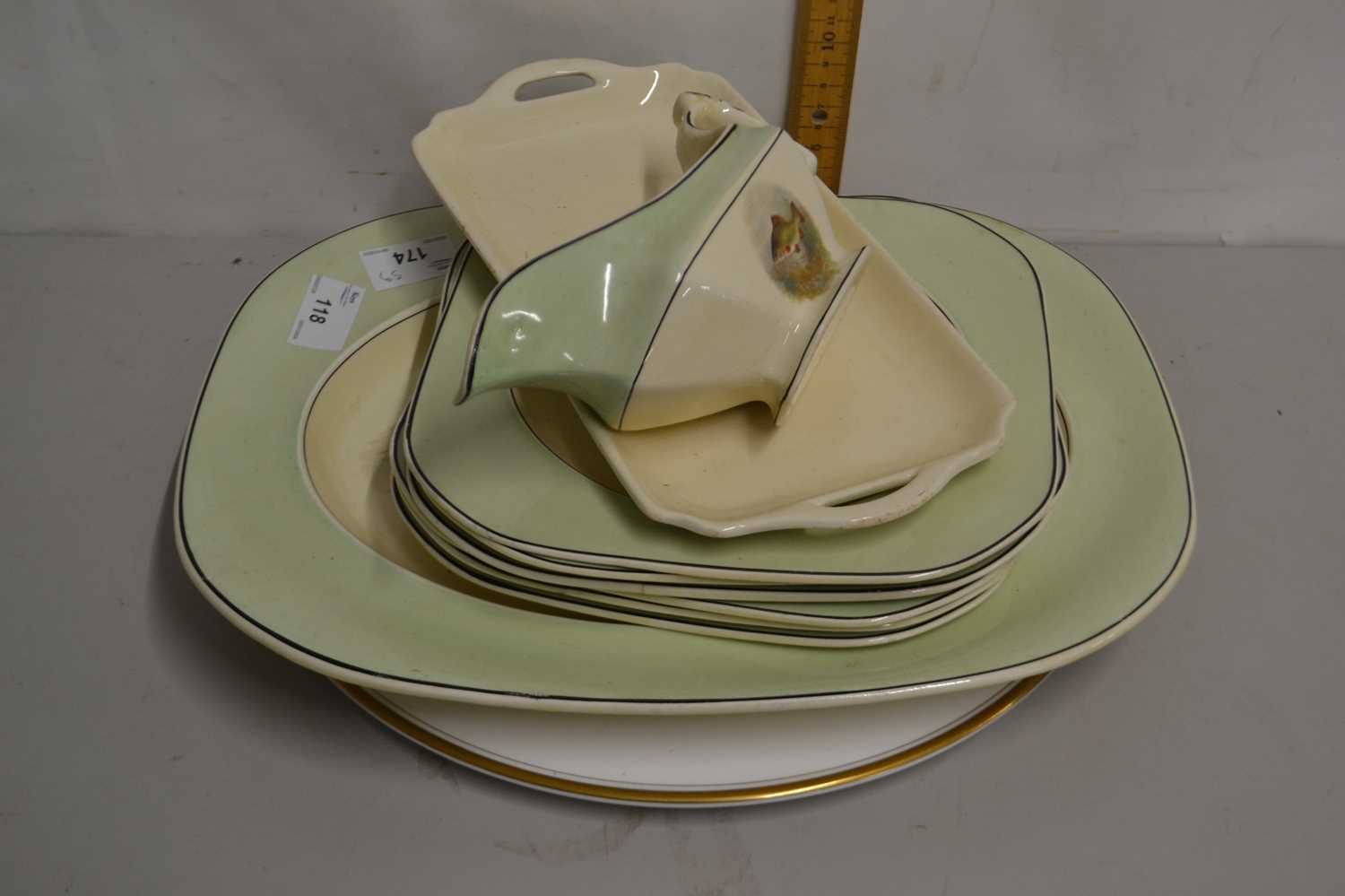 Quantity of Woods Ivory ware dinner plates, gravy boat, meat plate etc, all patterned with fish
