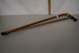 A horn handled walking stick and another