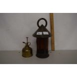 An Arts & Crafts style amber glass lantern together with a brass watering can