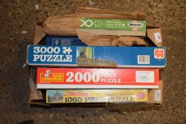 Box containing a quantity of jigsaws