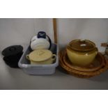 A stone ware pot and cover together with a large dish and a large round bread basket