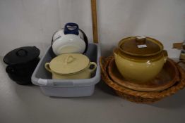 A stone ware pot and cover together with a large dish and a large round bread basket