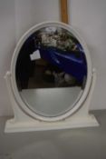 A white painted oval framed dressing table mirror