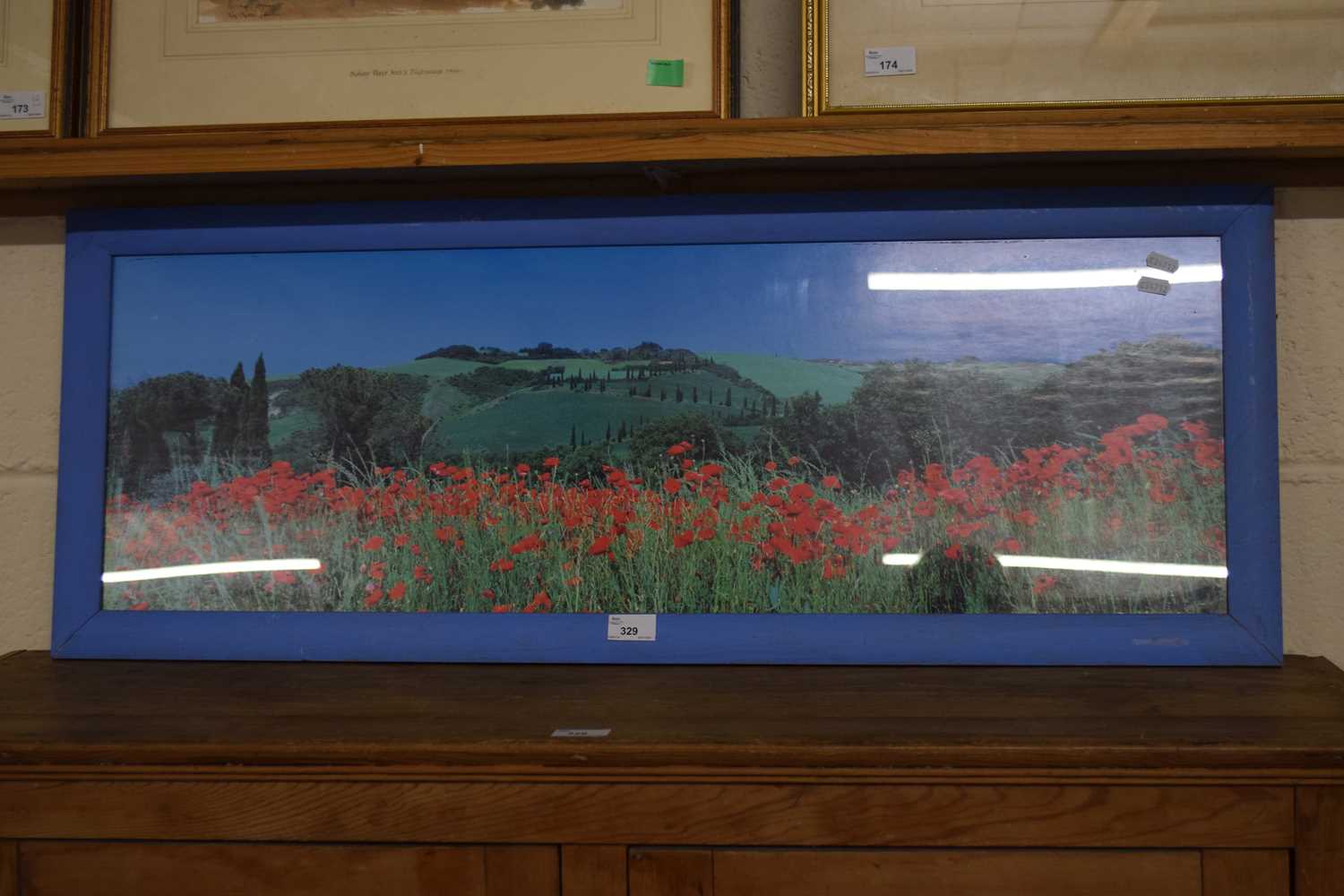 A photographic print of a poppy field